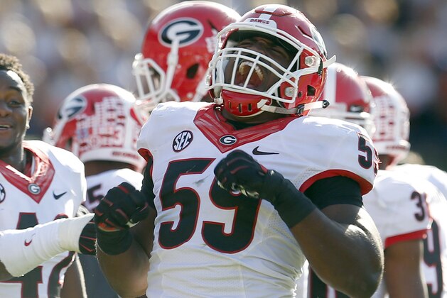 Georgia linebacker Jordan Jenkins (59) celebrates after an Auburn fumble during the second half of an NCAA football game, Saturday, Nov. 14, 2015, in Auburn, Ala. (AP Photo/Butch Dill)