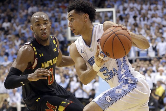 North Carolina's Marcus Paige (5) dribbles as Maryland's Rasheed Sulaimon (0) defends during the first half of an NCAA college basketball game in Chapel Hill, N.C., Tuesday, Dec. 1, 2015. (AP Photo/Gerry Broome)