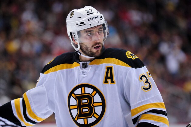 Oct 17, 2015; Glendale, AZ, USA; Boston Bruins center Patrice Bergeron (37) looks on during a face off in the third period against the Arizona Coyotes at Gila River Arena. Mandatory Credit: Matt Kartozian-USA TODAY Sports