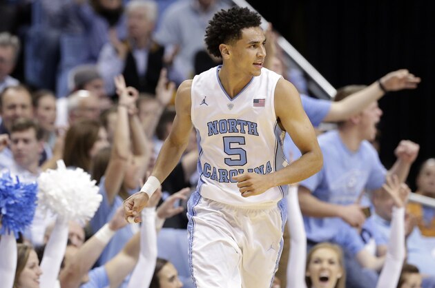 North Carolina's Marcus Paige (5) reacts following a basket against Maryland during the second half of an NCAA college basketball game in Chapel Hill, N.C., Tuesday, Dec. 1, 2015. North Carolina won 89-81. (AP Photo/Gerry Broome)
