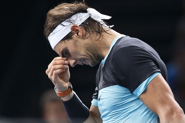 Rafael Nadal of Spain reacts after losing point against  Kevin Anderson of South Africa during their third round match of the BNP Masters tennis tournament at the Paris Bercy Arena, in Paris, France, Thursday, Nov. 5, 2015. (AP Photo/Michel Euler)