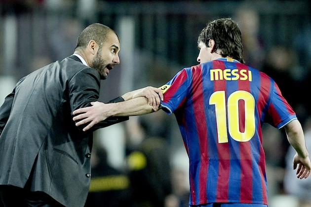 FC Barcelona's Lionel Messi from Argentina, right, chats with his coach Josep Guardiola after he scored against Athletic Bilbao during their Spanish La Liga soccer match at the Camp Nou stadium in Barcelona, Spain, Saturday, April 03, 2010. (AP Photo/David Ramos)