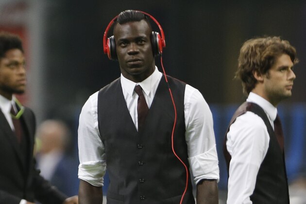 AC Milan's Mario Balotelli stands on the field prior to the start of a Serie A soccer match between Inter Milan and AC Milan, at the San Siro stadium in Milan, Italy, Sunday, Sept.13, 2015. (AP Photo/Luca Bruno)