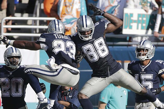 Dallas Cowboys wide receiver Dez Bryant (88) celebrates his touchdown with Robert Turbin (23) during the second half of an NFL football game against the Miami Dolphins, Sunday, Nov. 22, 2015, in Miami Gardens, Fla.  (AP Photo/Wilfredo Lee)