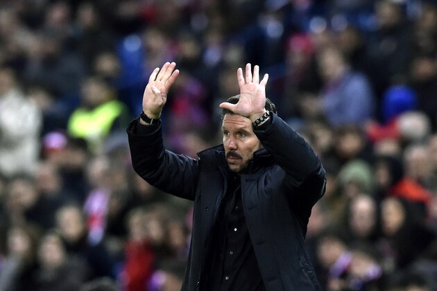 Atletico Madrid's Argentinian coach Diego Simeone gestures during the Spanish league football match Club Atletico de Madrid vs RCD Espanyol at the Vicente Calderon stadium in Madrid on November 28, 2015.   AFP PHOTO/ GERARD JULIEN / AFP / GERARD JULIEN        (Photo credit should read GERARD JULIEN/AFP/Getty Images)