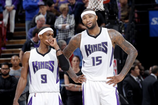 SACRAMENTO, CA - NOVEMBER 15: DeMarcus Cousins #15 and Rajon Rondo #9 of the Sacramento Kings look on during the game against the Toronto Raptors on November 15, 2015 at Sleep Train Arena in Sacramento, California. NOTE TO USER: User expressly acknowledges and agrees that, by downloading and or using this photograph, User is consenting to the terms and conditions of the Getty Images Agreement. Mandatory Copyright Notice: Copyright 2015 NBAE (Photo by Rocky Widner/NBAE via Getty Images)