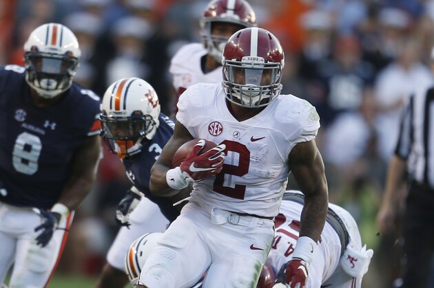 Alabama running back Derrick Henry (2) runs the ball during an NCAA college football game against Alabama, Saturday, Nov. 28, 2015, in Auburn, Ala. (AP Photo/Butch Dill)