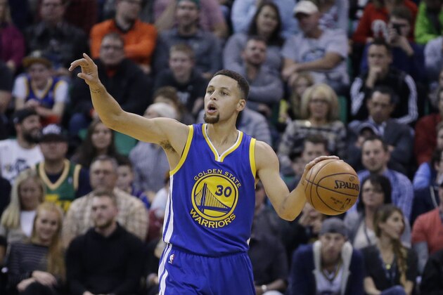 Golden State Warriors guard Stephen Curry (30) brings the ball up court in the second quarter during an NBA basketball game against the Utah Jazz Monday, Nov. 30, 2015, in Salt Lake City.  (AP Photo/Rick Bowmer)