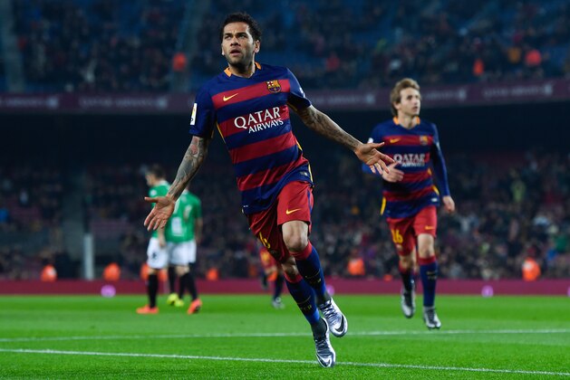 BARCELONA, SPAIN - DECEMBER 02:  Dani Alves of FC Barcelona celebrates after scoring the opening goal during the  Copa del Rey Round of 32 second leg match betwen FC Barcelona and Villanovense on December 2, 2015 in Barcelona, Spain.  (Photo by David Ramos/Getty Images)