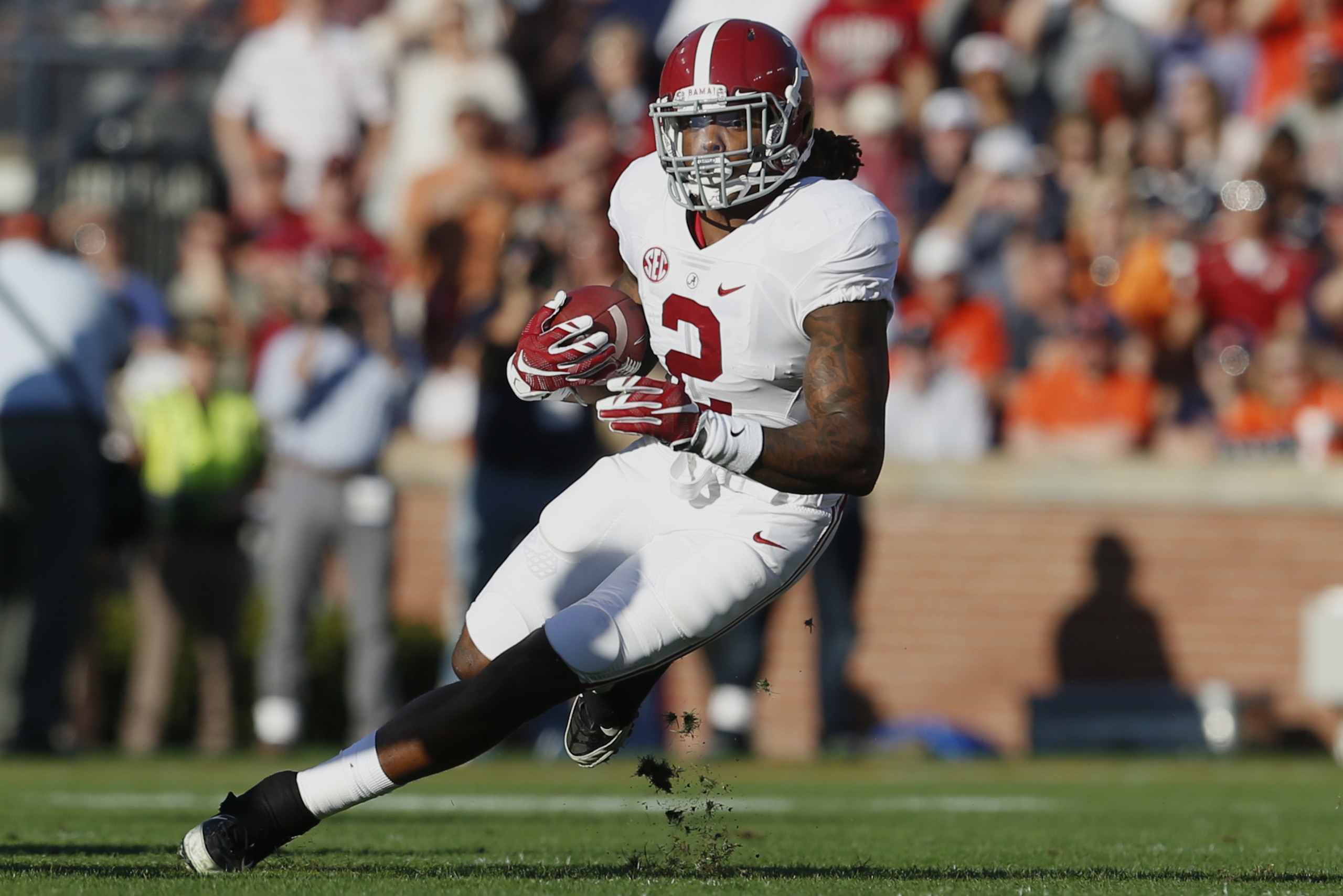 Alabama running back Derrick Henry (2) runs the ball during an NCAA college football game against Auburn, Saturday, Nov. 28, 2015, in Auburn, Ala. Alabama won 29-13. (AP Photo/Butch Dill)