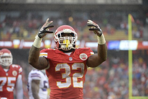 Nov 29, 2015; Kansas City, MO, USA; Kansas City Chiefs running back Spencer Ware (32) celebrates after scoring a touchdown against the Buffalo Bills in the first half at Arrowhead Stadium. Mandatory Credit: John Rieger-USA TODAY Sports