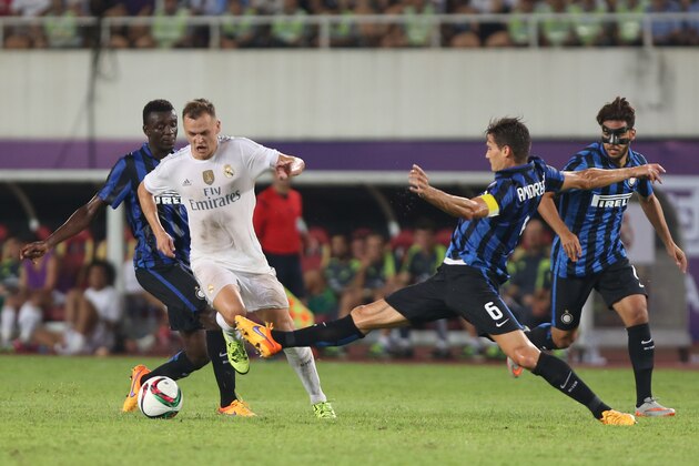GUANGZHOU, CHINA - JULY 27: Denis Cheryshev of Real Madrid competes with Andreolli Marco of FC Internazionale during the match of International Champions Cup China 2015 between Real Madrid and FC Internazionale at Tianhe Stadium on July 27, 2015 in Guangzhou, China. (Photo by Zhong Zhi/Getty Images)