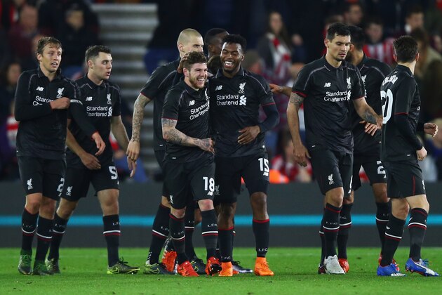 SOUTHAMPTON, ENGLAND - DECEMBER 02:  Alberto Moreno (18) and Daniel Sturridge of Liverpool (15) celebrate with team mates as Divock Origi scores their third goal during the Capital One Cup quarter final match between Southampton and Liverpool at St Mary's Stadium on December 2, 2015 in Southampton, England.  (Photo by Clive Rose/Getty Images)