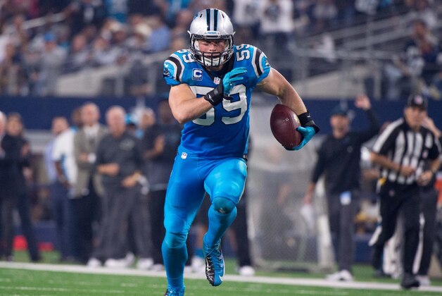 Nov 26, 2015; Arlington, TX, USA; Carolina Panthers middle linebacker Luke Kuechly (59) returns an interception for a touchdown against the Dallas Cowboys on Thanksgiving at AT&T Stadium. The Panthers defeat the Cowboys 33-14. Mandatory Credit: Jerome Miron-USA TODAY Sports