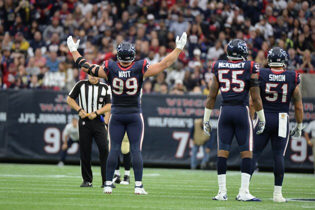 Houston Texans defensive end J.J. Watt (99) fires up the crowd during the second quarter of an NFL football game, Sunday, Nov. 29, 2015, in Houston. (AP Photo/George Bridges)