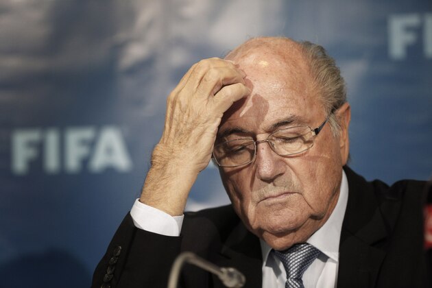FILE - In this Dec. 19, 2014 file photo FIFA President Sepp Blatter gestures as he attends a press conference in Marrakech, Morocco. (AP Photo/Christophe Ena, file)