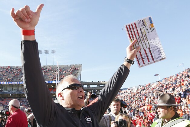 Georgia head coach Mark Richt celebrates as he walks off the field after they defeated Auburn 20-13 in an NCAA football game, Saturday, Nov. 14, 2015, in Auburn, Ala. (AP Photo/Butch Dill)
