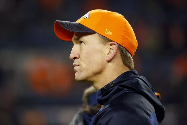 Denver Broncos injured quarterback Peyton Manning watches prior to an NFL football game against the New England Patriots, Sunday, Nov. 29, 2015, in Denver. (AP Photo/Jack Dempsey)
