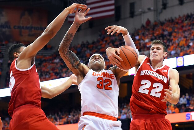 Dec 2, 2015; Syracuse, NY, USA; Wisconsin Badgers forward Charlie Thomas (L) and Syracuse Orange center DaJuan Coleman (32) and Wisconsin Badgers forward Ethan Happ (22) battle for a loose ball during the first half at the Carrier Dome.  Mandatory Credit: Rich Barnes-USA TODAY Sports