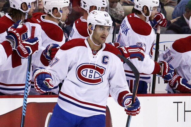 Montreal Canadiens' Max Pacioretty (67) returns to the bench after scoring his second goal of the game in the second period of an NHL hockey game against the Pittsburgh Penguins in Pittsburgh Tuesday, Oct. 13, 2015.(AP Photo/Gene J. Puskar)