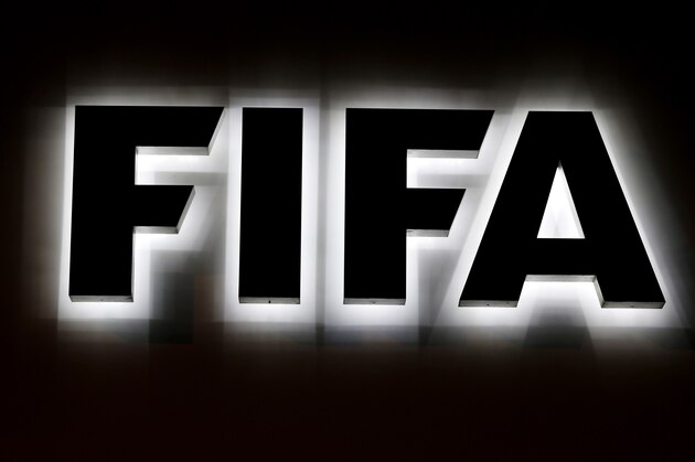 The FIFA logo outside FIFA headquarters in Zurich, Switzerland, Friday, Sept. 25, 2015. Despite hastily canceling a news conference scheduled with President Sepp Blatter after the surprise arrival of Swiss federal police at its headquarters, FIFA did make some decisions during its two-day executive committee meeting that ended Friday. (AP Photo/Michael Probst)