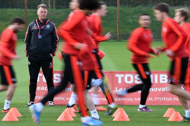 Manchester United's Dutch manager Louis van Gaal watches his players take part part in a training session at their Carrington facility in Manchester, north west England on October 20, 2015 ahead of their Champions League football match against CSKA Moscow on October 21. AFP PHOTO / PAUL ELLIS        (Photo credit should read PAUL ELLIS/AFP/Getty Images)