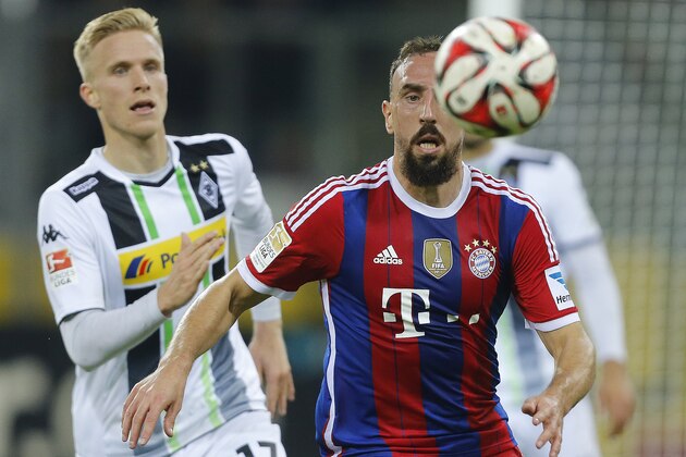 Moenchengladbach's Oscar Wendt, left, and Bayern's Franck Ribery challenge for the ball during the German first division Bundesliga soccer match between Borussia Moenchengladbach and Bayern Munich in Moenchengladbach, Germany, Sunday, Oct. 26, 2014. (AP Photo/Frank Augstein)