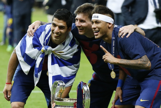 Barcelona's Lionel Messi, centre, Neymar and Luis Suarez, left, celebrate with the trophy after after the Champions League final soccer match between Juventus Turin and FC Barcelona at the Olympic stadium in Berlin Saturday, June 6, 2015. Barcelona won the match 3-1. (AP Photo/Luca Bruno) Barcelona's Lionel Messi, centre, Neymar and Luis Suarez, left, celebrate with the trophy after after the Champions League final soccer match between Juventus Turin and FC Barcelona at the Olympic stadium in Berlin Saturday, June 6, 2015. Barcelona won the match 3-1. (AP Photo/Luca Bruno)