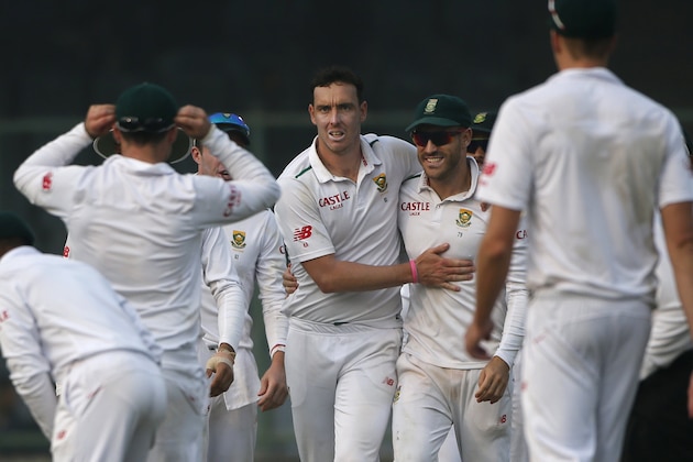 South African cricketers celebrate after Kyle Abbott, fourth left, takes the wicket of Indian batsman Ravindra Jadeja, on the first day of the fourth test match between the two countries, in New Delhi, India, Thursday, Dec. 3, 2015. (AP Photo /Tsering Topgyal)