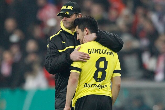 MUNICH, GERMANY - FEBRUARY 27:  Ilkay Guendogan (R) and head coach Juergen Klopp of Dortmund look dejected after loosing the DFB Cup Quarter Final match between FC Bayern Muenchen and Borussia Dortmund at Allianz Arena on February 27, 2013 in Munich, Germany.  (Photo by Boris Streubel/Getty Images)