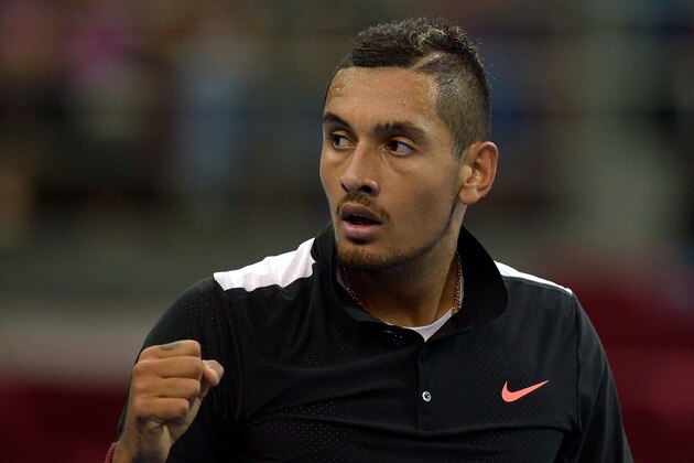 Australia's Nick Kyrgios reacts after defeating Croatia's Ivo Karlovic during their men's singles quarter-final match of the 2015 Malaysian Open tennis tournament in Kuala Lumpur on October 2, 2015.  AFP PHOTO / MANAN VATSYAYANA        (Photo credit should read MANAN VATSYAYANA/AFP/Getty Images)