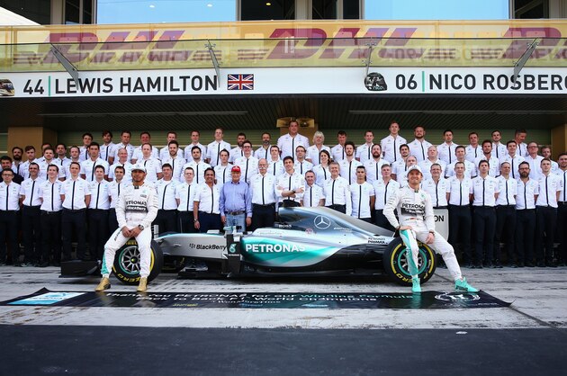 ABU DHABI, UNITED ARAB EMIRATES - NOVEMBER 29:  Lewis Hamilton of Great Britain and Mercedes GP and Nico Rosberg of Germany and Mercedes GP take part in the team photograph in the pit lane before the Abu Dhabi Formula One Grand Prix at Yas Marina Circuit on November 29, 2015 in Abu Dhabi, United Arab Emirates.  (Photo by Clive Mason/Getty Images)