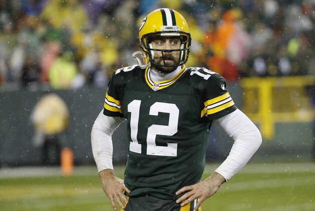 Green Bay Packers' Aaron Rodgers walks off the field after failing to complete on fourth down in the final seconds of an NFL football game against the Chicago Bears Thursday, Nov. 26, 2015, in Green Bay, Wis. The Bears won 17-13. (AP Photo/Morry Gash)