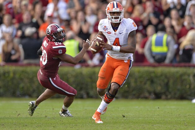 Clemson quarterback Deshaun Watson scrambles out of the pocket looking for a receiver during the second half of an NCAA college football game against South Carolina Saturday, Nov. 28, 2015, in Columbia, S.C. Clemson won 37-32. (AP Photo/Richard Shiro)
