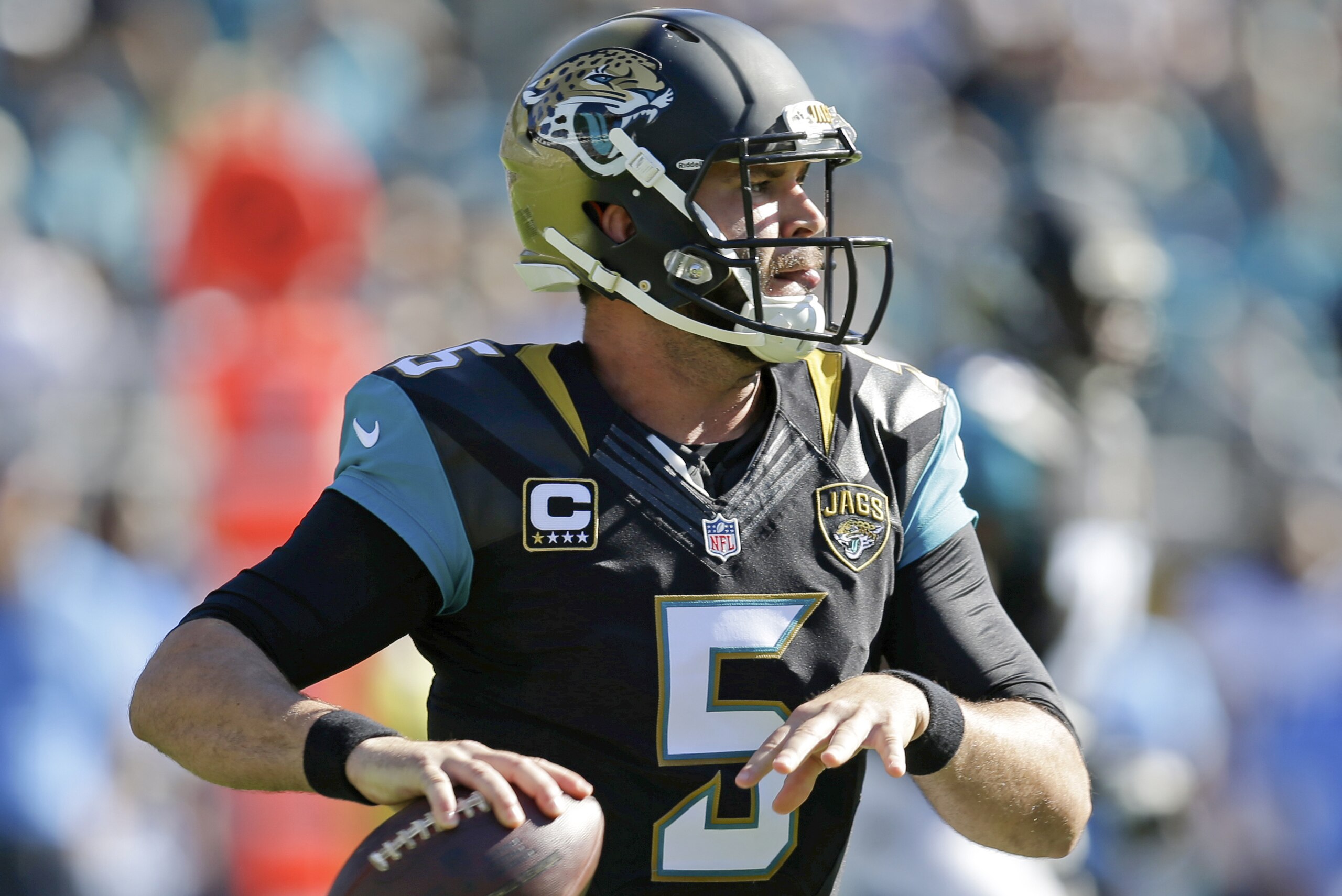 Jacksonville Jaguars quarterback Blake Bortles looks for a receiver against the San Diego Chargers during the first half of an NFL football game in Jacksonville, Fla., Sunday, Nov. 29, 2015.(AP Photo/John Raoux)