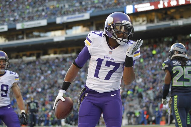Minnesota Vikings' Jarius Wright blows a kiss after scoring against the Seattle Seahawks in the first half of an NFL football game, Sunday, Nov. 17, 2013, in Seattle. (AP Photo/John Froschauer)