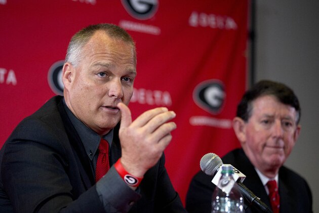 University of Georgia head football coach Mark Richt speaks as athletic director Greg McGarity looks on during a news conference to discuss Richt's departure from Georgia, Monday, Nov. 30, 2015, in Athens, Ga. McGarity said in a statement released by the school the two