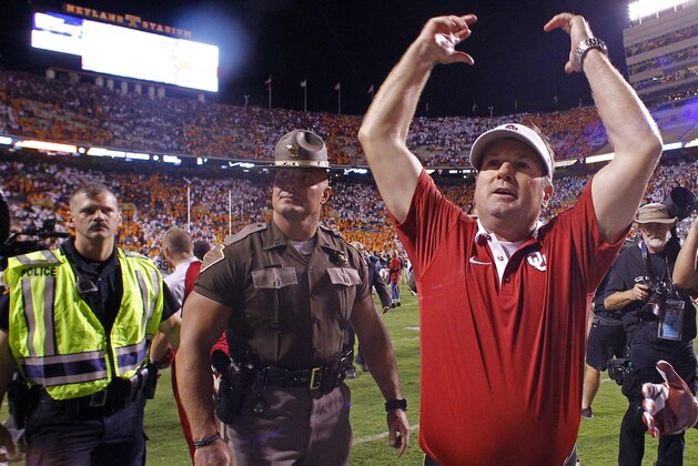 FILE - In this Saturday, Sept. 12, 2015, file photo, Oklahoma head coach Bob Stoops celebrates after defeating Tennessee 31-24 in double overtime of an NCAA college football game in Knoxville, Tenn. When players hear all week about the importance of playing with passion, sometimes they end up showing too much emotion at the wrong time. Inevitably, someone’s always watching with a camera ready to capture any misstep. That’s a lesson a few players learned the hard way last week. Oklahoma safety Hatari Byrd pointed a middle finger toward the stands, and linebacker Eric Striker shouted foul language while vocalizing his opinions on the Southeastern Conference following the Sooners’ 31-24 overtime victory at Tennessee. (AP Photo/Wade Payne, File)