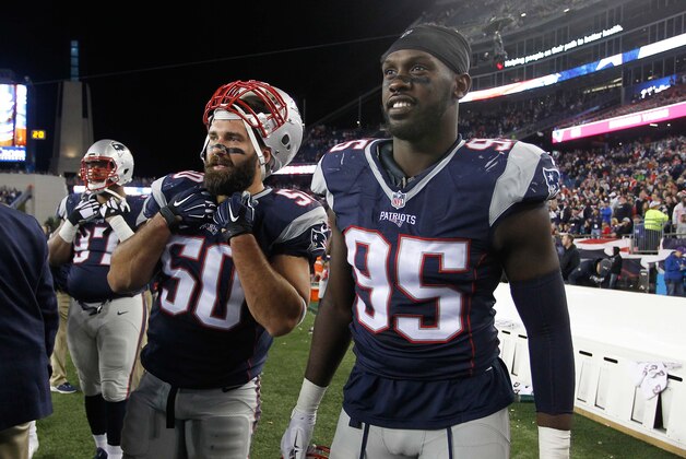 Oct 29, 2015; Foxborough, MA, USA; New England Patriots defensive end Rob Ninkovich (50) and defensive end Chandler Jones (95) on the sideline during the fourth quarter against the Miami Dolphins at Gillette Stadium. Mandatory Credit: Stew Milne-USA TODAY Sports