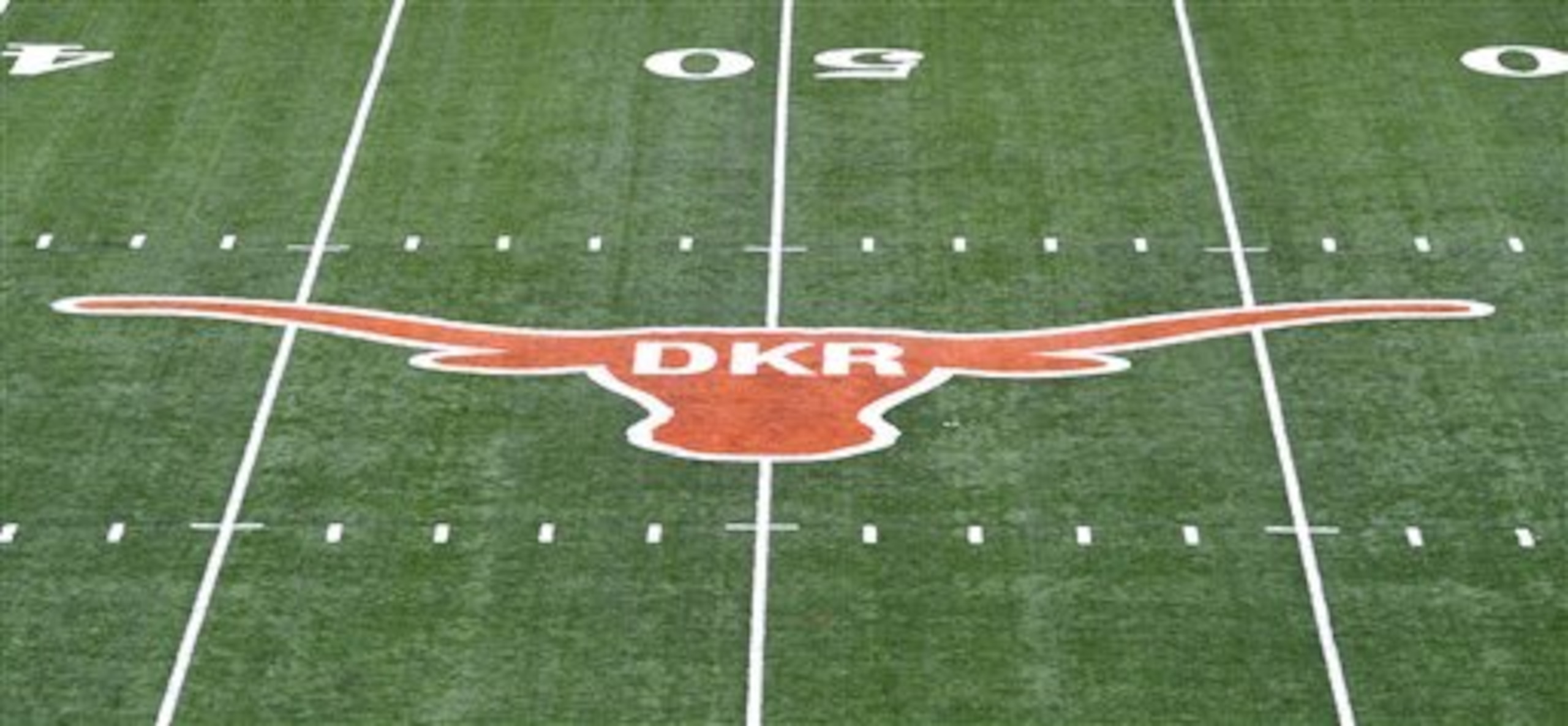 The initials of former Texas football coach Darrell K. Royal were painted inside the longhorn logo on the field at Darrell K. Royal-Memorial Stadium, Saturday, Nov. 10, 2012, in Austin, Texas. The initials were added in honor of Royal who passed away on Wednesday. (AP Photo/Michael Thomas)