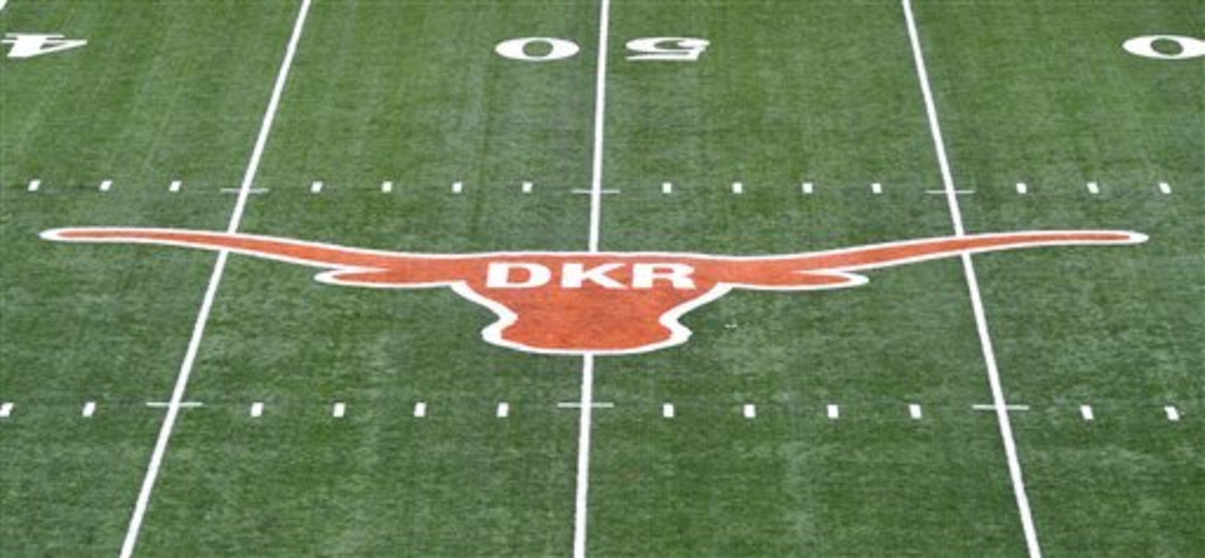 The initials of former Texas football coach Darrell K. Royal were painted inside the longhorn logo on the field at Darrell K. Royal-Memorial Stadium, Saturday, Nov. 10, 2012, in Austin, Texas. The initials were added in honor of Royal who passed away on Wednesday. (AP Photo/Michael Thomas)