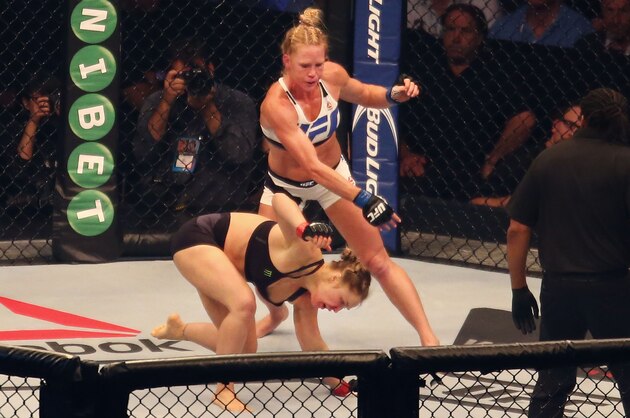 MELBOURNE, AUSTRALIA - NOVEMBER 15:  Holly Holm of the United States knocks down Ronda Rousey of the United States in the second round in their UFC women's bantamweight championship bout during the UFC 193 event at Etihad Stadium on November 15, 2015 in Melbourne, Australia.  (Photo by Scott Barbour /Zuffa LLC/Zuffa LLC via Getty Images)