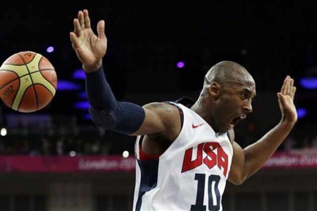 United States' Kobe Bryant reacts after a dunk during a men's gold medal basketball game against Spain at the 2012 Summer Olympics, Sunday, Aug. 12, 2012, in London. (AP Photo/Eric Gay)