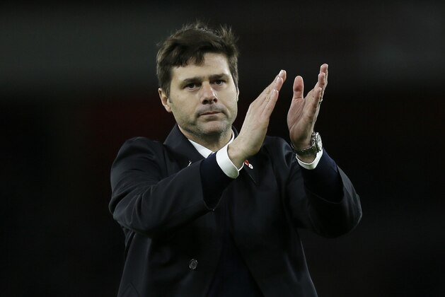 Tottenham manager Mauricio Pochettino applauds the fans after the English Premier League soccer match between Arsenal and Tottenham Hotspur at the Emirates Stadium in London, Sunday Nov. 8, 2015. (AP Photo/Tim Ireland)