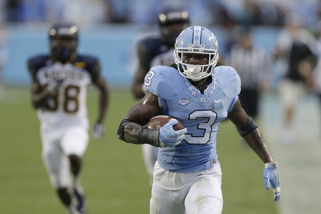 North Carolina's Sam Smiley runs the ball following an interception against North Carolina A&T during the first half of an NCAA college football game in Chapel Hill, N.C., Saturday, Sept. 12, 2015. (AP Photo/Gerry Broome)