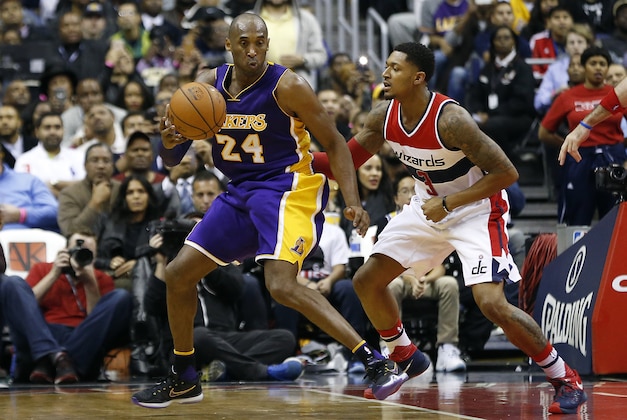 Dec 2, 2015; Washington, DC, USA; Los Angeles Lakers forward Kobe Bryant (24) dribbles the ball as Washington Wizards guard Bradley Beal (3) defends in the fourth quarter at Verizon Center. The Lakers won 108-104. Mandatory Credit: Geoff Burke-USA TODAY Sports