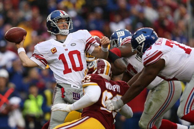 LANDOVER, MD - NOVEMBER 29: Quarterback Eli Manning #10 of the New York Giants throws the ball while under pressure by outside linebacker Trent Murphy #93 of the Washington Redskins in the second quarter at FedExField on November 29, 2015 in Landover, Maryland. (Photo by Patrick Smith/Getty Images)