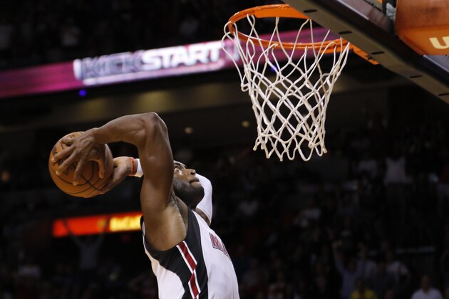 Miami Heat guard Dwyane Wade goes in for a dunk late in the fourth quarter against the Oklahoma City Thunder in an NBA basketball game, Thursday, Dec. 3, 2015, in Miami. The Heat won 97-95. (AP Photo/Joe Skipper)