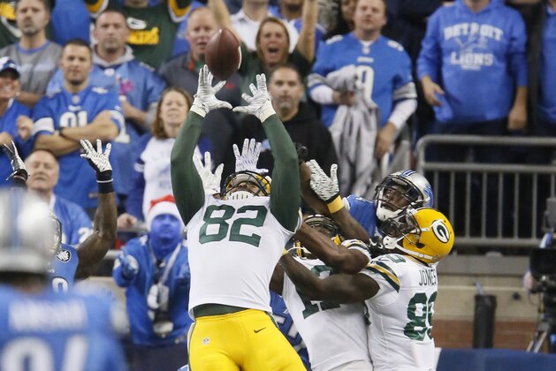 Green Bay Packers tight end Richard Rodgers (82) reaches to catch the game winning pass on the last play of an NFL football game against the Detroit Lions, Thursday, Dec. 3, 2015, in Detroit. The Packers defeated the Lions 27-23. (AP Photo/Duane Burleson)