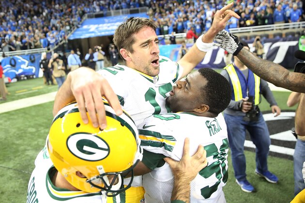 DETROIT MI - DECEMBER 3: Aaron Rodgers #12 of the Green Bay Packers celebrates with teammate B.J. Raji #90 after beating the Detroit Lions 27-23 on December 3 2015 at Ford Field in Detroit, Michigan. (Photo by Leon Halip/Getty Images)